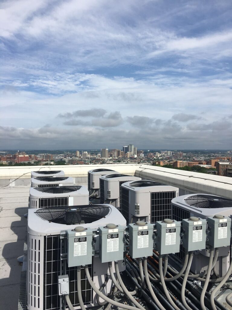 Air conditioners on top of a downtown condo