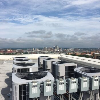 Air conditioners on top of a downtown condo