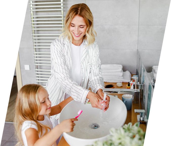 Mother and child brushing teeth