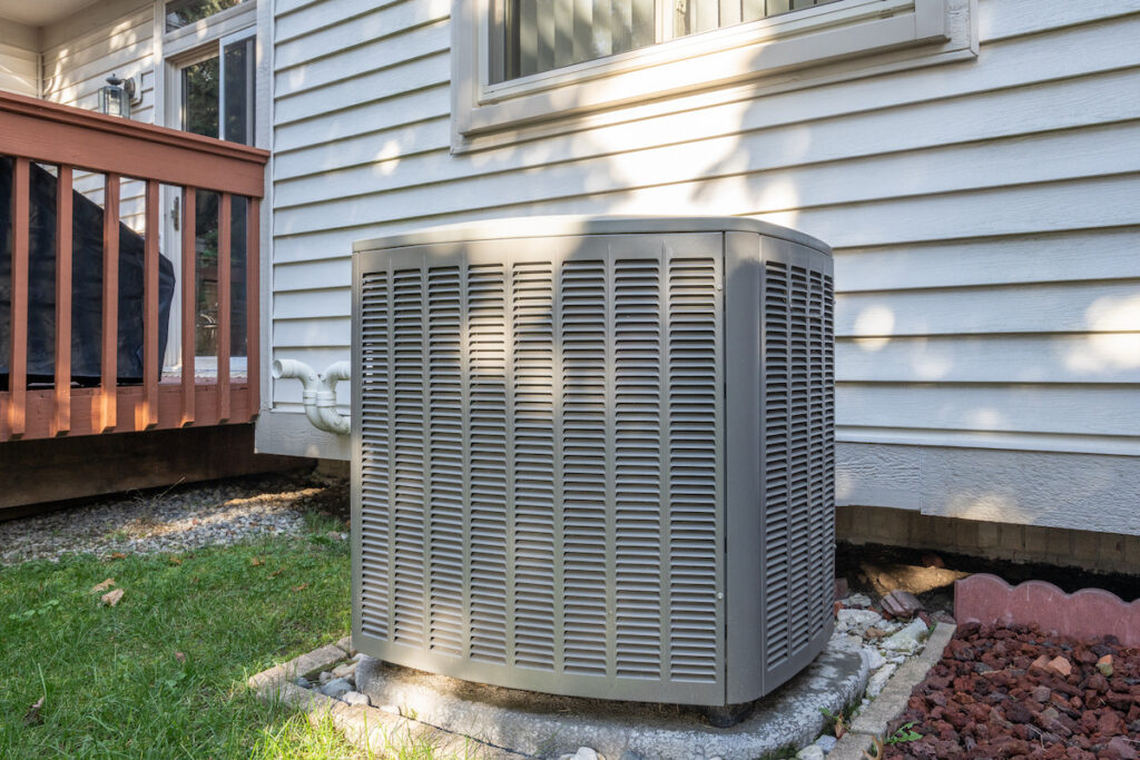 residential air conditioning unit with a new condenser unit at a Birmingham, AL home