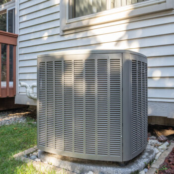 residential air conditioning unit with a new condenser unit at a Birmingham, AL home